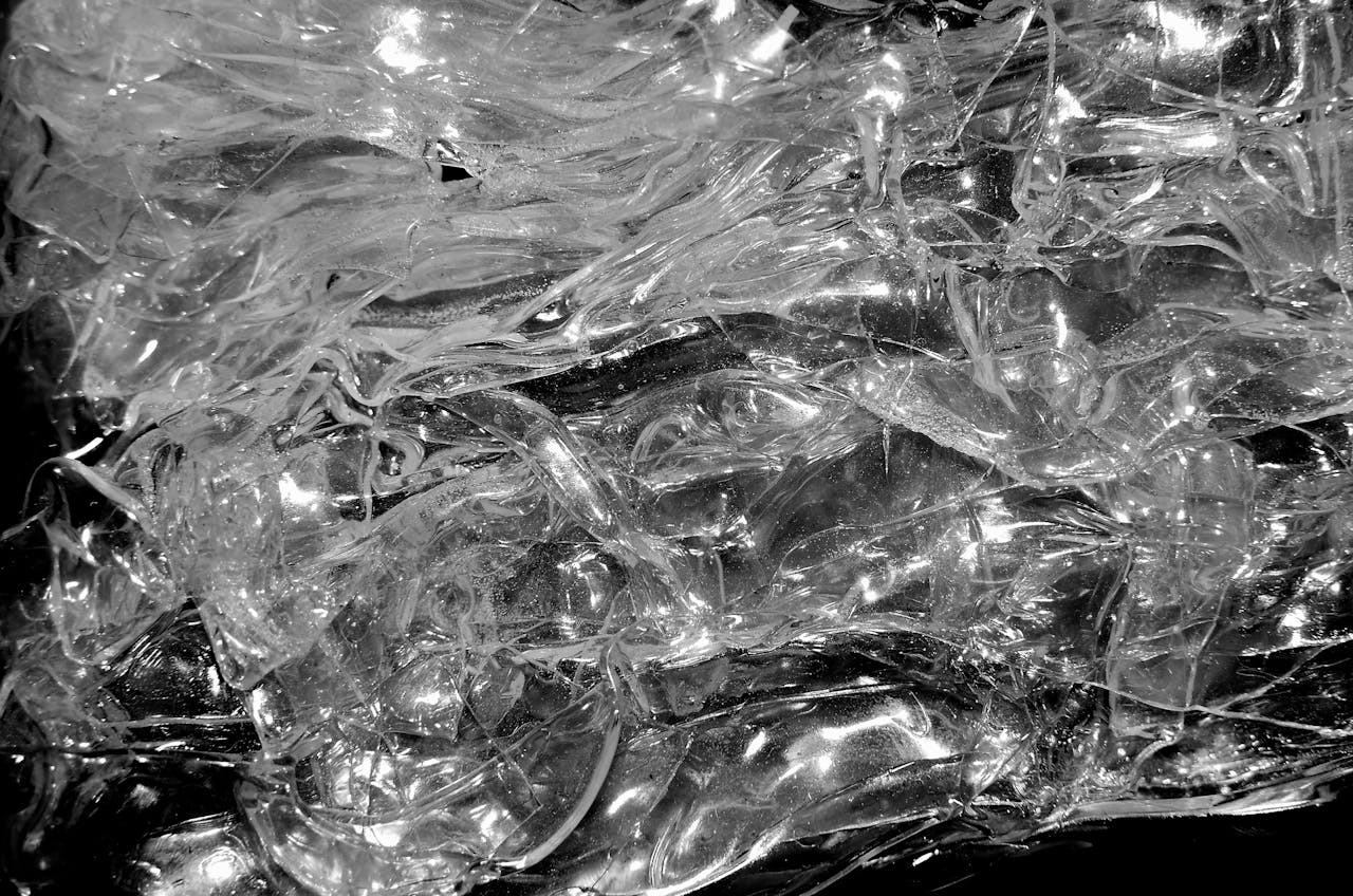 From above of transparent clear shiny crystal plastic shapeless texture for abstract background